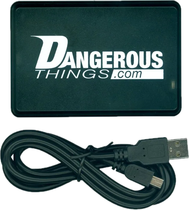 KBR1 NFC reader, a small black pad with the Dangerous Things logo, shown with its USB cable