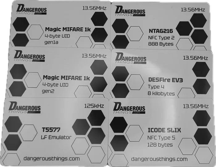 Six test cards fanned out, Magic MIFARE 1k gen1 and gen2, NTAG216, DESFire EV3, ICODE SLIX and a 125kHz T5577 emulator