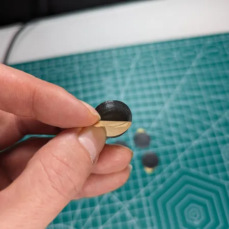 Repeater sticker being peeled from its backing sheet